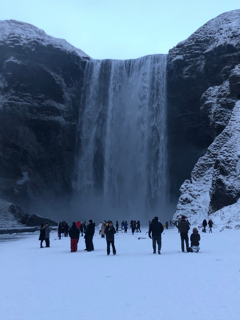 I was able to persuade my family to visit during New Year's Eve, and we did our own little tour of the South, which was when I took this photo of Skogafoss with all the snow.